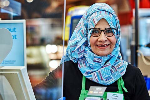 Sobeys cashier standing at her checkout.